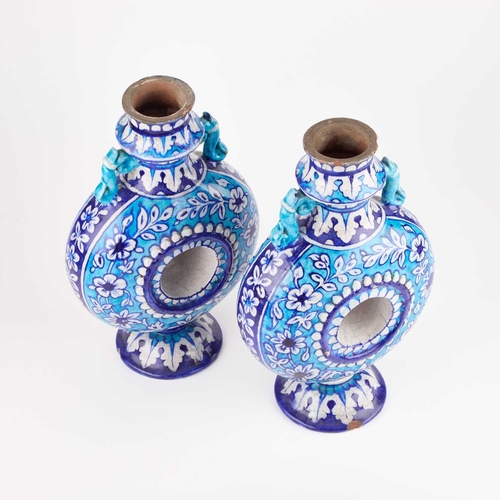 27 - BOMBAY SCHOOL OF ARTS: A PAIR OF POTTERY FLASKS IN THE MULTAN STYLE, INDIA, CIRCA 1880 (2) 29cm high... 