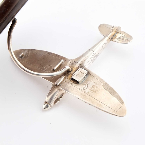 285 - AN ELIZABETH II SILVER MODEL OF A SPITFIRE by CFL, London 1986, raised on a turned wooden base. 13cm... 