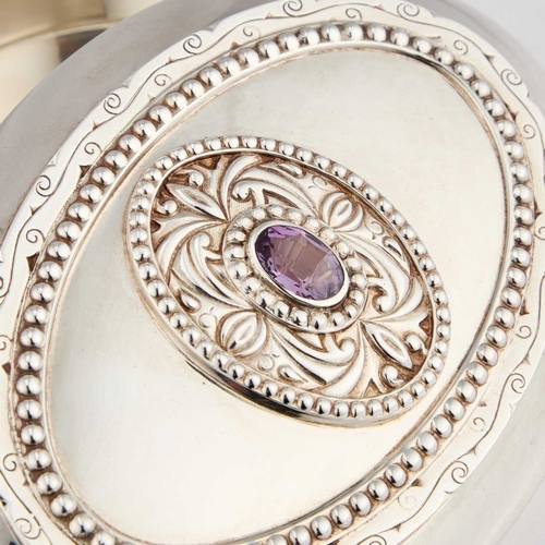 293 - AN ELIZABETH II SILVER AND AMETHYST BOX by Garrard & Co Ltd, London 2007, oval. 13.5cm long, 10.... 