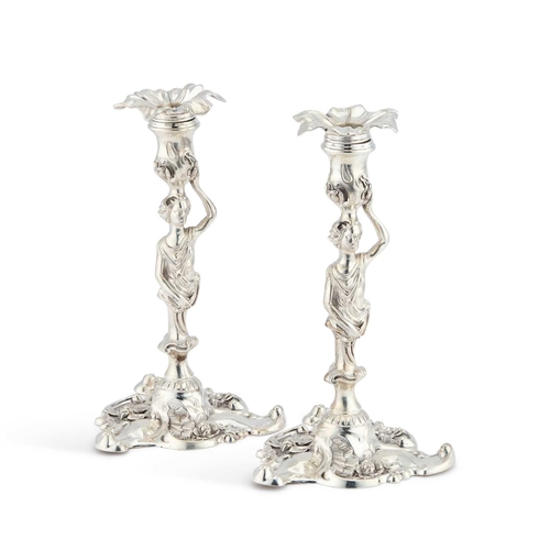 302 - A FINE PAIR OF ELIZABETH II CAST SILVER CANDLESTICKS by H Ltd, Sheffield 1969, each stem cast as a c... 