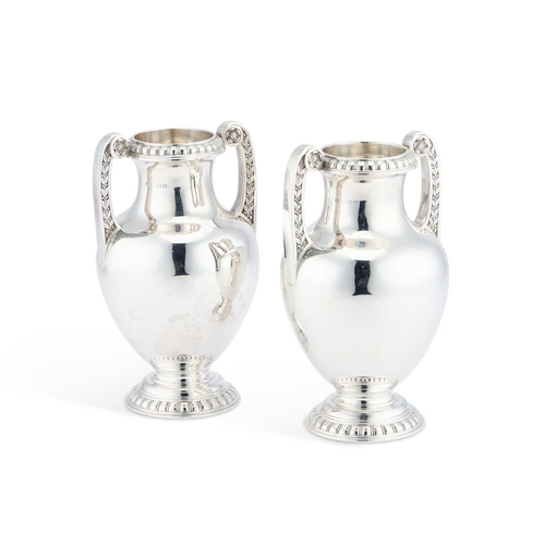 322 - A PAIR OF GEORGE V SILVER TWO-HANDLED VASES by Garrard & Co Ltd, London 1927, each with bead and... 