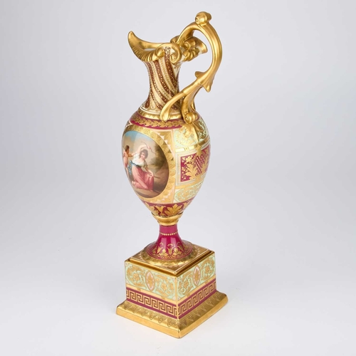 33 - A VIENNA PORCELAIN MAGENTA-GROUND EWER AND STAND late 19th Century, of baluster form with a tall scr... 