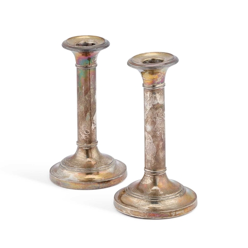 332 - A PAIR OF EDWARDIAN SILVER CANDLESTICKS by Charles Boyton & Son Ltd, Birmingham 1908, of plain c... 