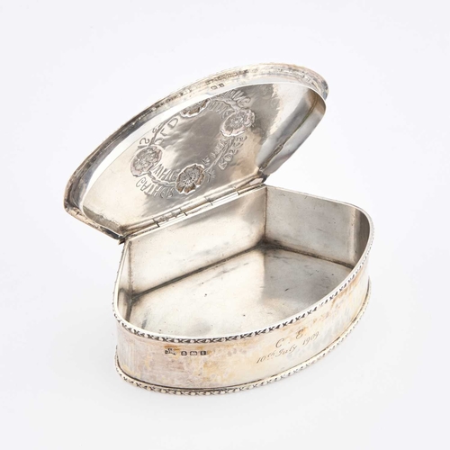 345 - AN ARTS AND CRAFTS SILVER BOX by George Laurence Connell, Birmingham 1908, bow-fronted, the lid chas... 