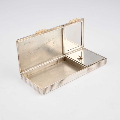 352 - CARTIER: AN ART DECO SILVER COMPACT by Cartier Ltd, London 1940, with double hinged covers, in the o... 