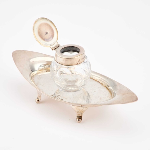 354 - AN EDWARDIAN SILVER INKSTAND by Asprey & Co Ltd, Birmingham 1907, boat-shaped. 17.5cm long, 2.7 ... 