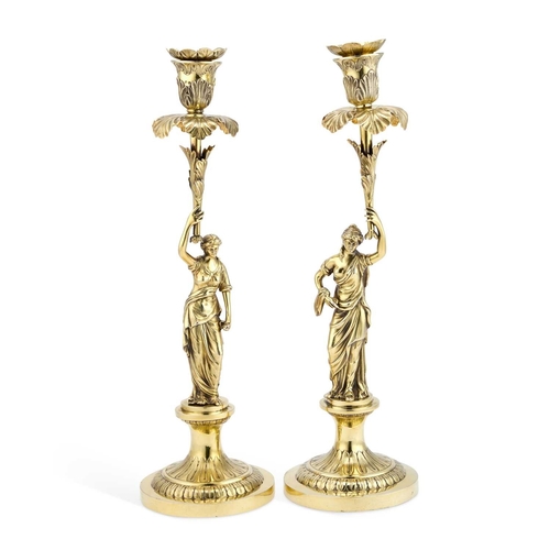 422 - A FINE PAIR OF GEORGE III CAST SILVER-GILT FIGURAL CANDLESTICKS by Thomas Pitts II, London 1804, eac... 