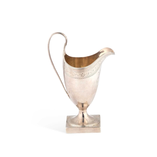 429 - A GEORGE III SILVER CREAM JUG by Thomas Oliphant (or Ollivant), London 1790, of helmet-form, with br... 