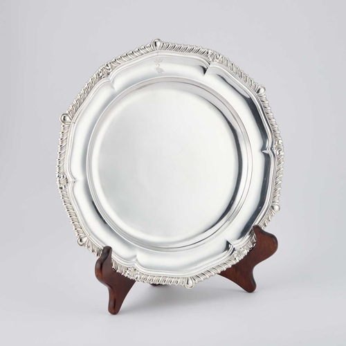 451 - A SET OF TWELVE REGENCY SILVER DINNER PLATES by Paul Storr, London 1817, the shallow bowls with shel... 