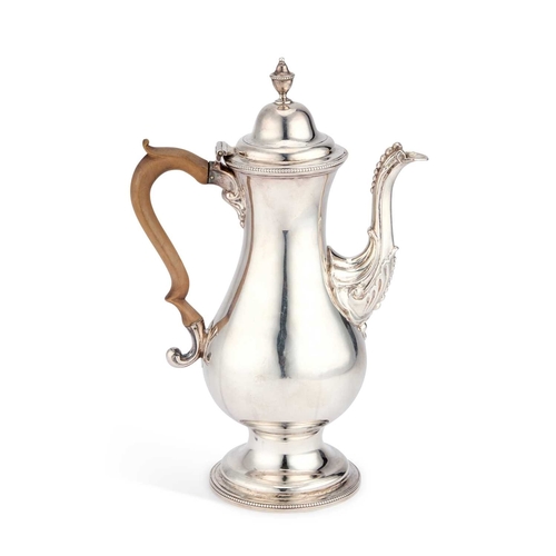 455 - A GEORGE III SILVER COFFEE POT by Benjamin Mountigue, London 1783, of baluster form, the beaded spou... 