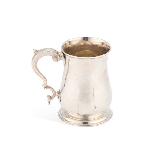 459 - AN EARLY GEORGE III SILVER MUG by William Shaw II, London 1764, of baluster form, with a double scro... 