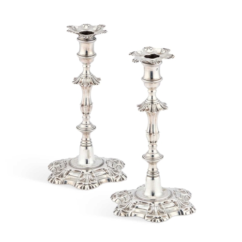 465 - A PAIR OF GEORGE II CAST SILVER CANDLESTICKS by John Hyatt & Charles Semore, London 1757, each w... 