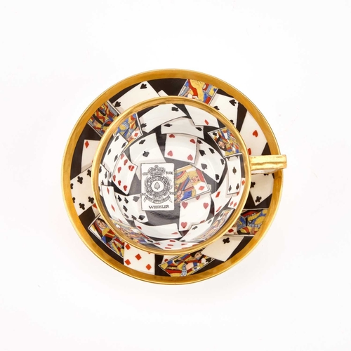 51 - A RARE DERBY TROMPE L'OEIL 'PLAYING CARDS' CUP AND SAUCER, CIRCA 1815 boldly painted with a deck of ... 