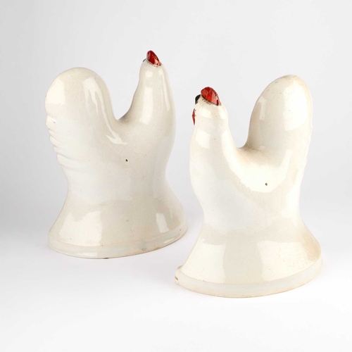 52 - A LARGE PAIR OF STAFFORDSHIRE POTTERY COCKERELS, CIRCA 1860 the white ground body moulded with feath... 