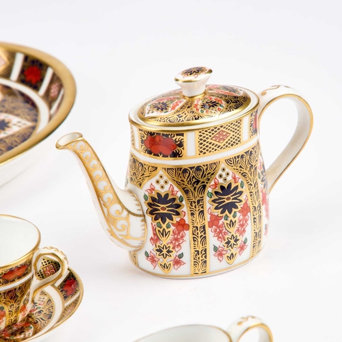 55 - A ROYAL CROWN DERBY IMARI MINIATURE TEA SERVICE comprising a teapot, sugar bowl, cream jug, cup and ... 