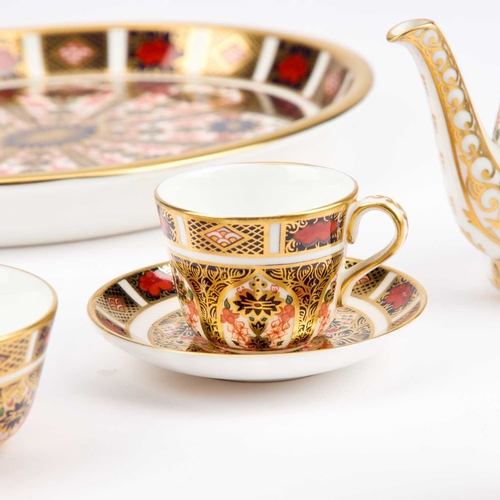 55 - A ROYAL CROWN DERBY IMARI MINIATURE TEA SERVICE comprising a teapot, sugar bowl, cream jug, cup and ... 