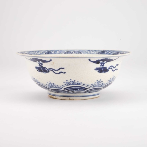 77 - A BLUE AND WHITE BOWL IN SOFT PASTE decorated along the well with four large fish. 20.5cm diameterBo... 