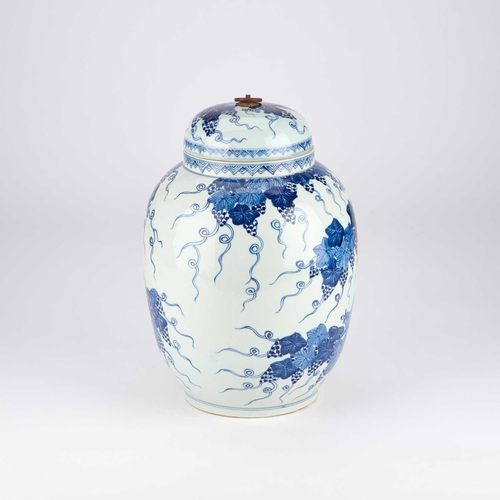 92 - A CHINESE BLUE AND WHITE 'SQUIRREL AND GRAPE' JAR AND COVER the lid with an iron loop handle, the ba... 