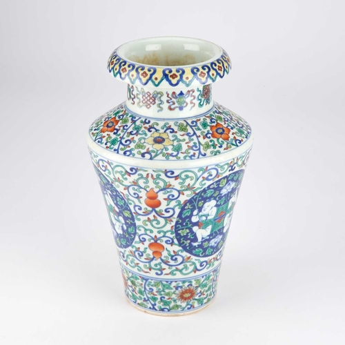 97 - A CHINESE DOUCAI VASE of tapering cylindrical form with an everted rim, the neck painted with eight ... 