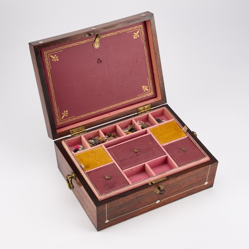 114 - A REGENCY MOTHER-OF-PEARL INLAID ROSEWOOD SEWING BOX rectangular, with brass axe-head handles, the i... 