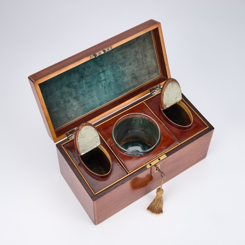 129 - A GEORGE III MAHOGANY TEA CADDY rectangular, satinwood banded and ebony strung, the hinged lid with ... 