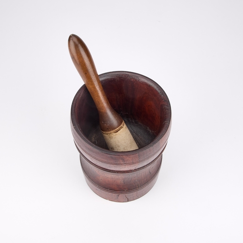 147 - A EARLY 18TH CENTURY LIGNUM VITAE MORTAR TOGETHER WITH A PESTLE (2) Mortar 17.5cm high