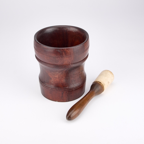 147 - A EARLY 18TH CENTURY LIGNUM VITAE MORTAR TOGETHER WITH A PESTLE (2) Mortar 17.5cm high