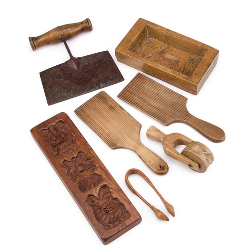 206 - A PAIR OF VICTORIAN BUTTER PATS together with a dough cutter, a pastry wheel, a pair of sugar tong a... 