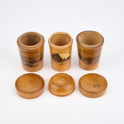 244 - THREE MAUCHLINE WARE GLASS HOLDERS each decorated with a titled and printed scene. (3) Tallest 8.5cm... 