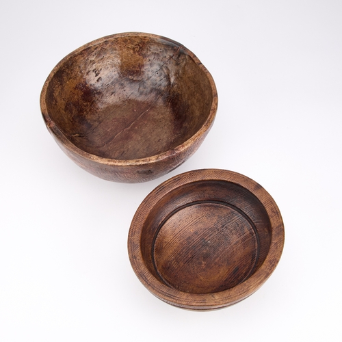 276 - TWO TREEN BOWLS (2) Largest 28cm diameter