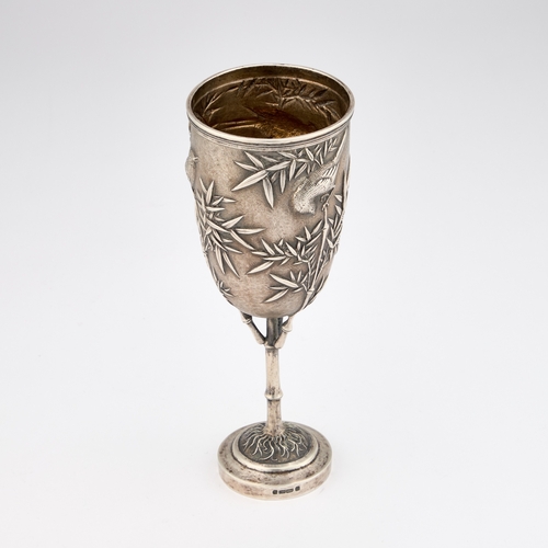 354 - A 19TH CENTURY CHINESE SILVER GOBLET marked to the side of the foot, the ovoid bowl chased with bird... 