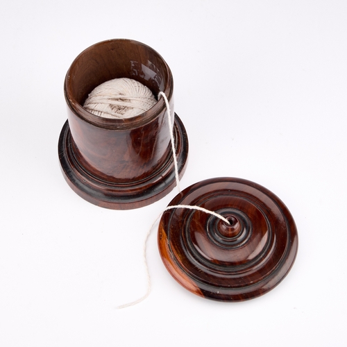 37 - A 19TH CENTURY LIGNUM VITAE STRING BOX cylindrical form. 13cm high