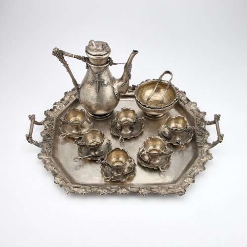 389 - Â§ AN AUSTRO-HUNGARIAN SILVER COFFEE SERVICE by BrÃ¼der Frank, Vienna, c.1900, in a rusticated tromp... 