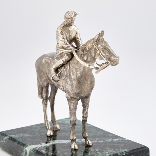 409 - AN ELIZABETH II SILVER MODEL OF A MOUNTED JOCKEY maker's mark illegible, London 1985, realistically ... 