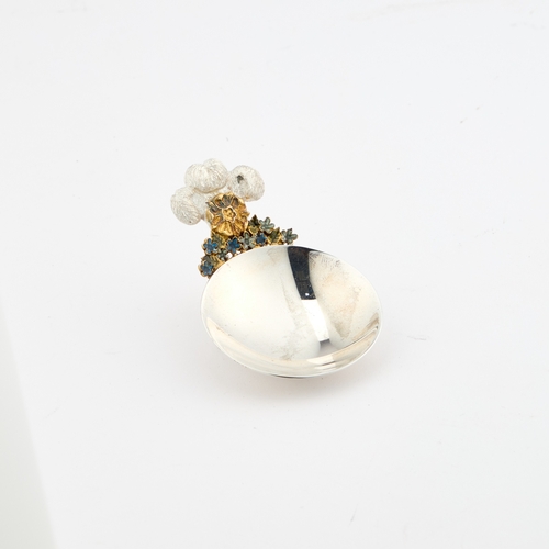 422 - STUART DEVLIN: AN ELIZABETH II PARCEL-GILT SILVER AND ENAMEL CADDY SPOON by Stuart Devlin, London 19... 