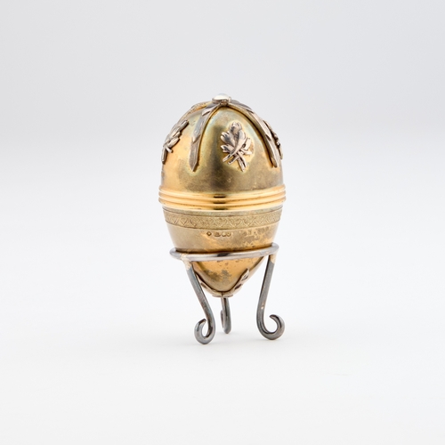 425 - A FABERGÃ STYLE PARCEL-GILT SILVER EGG by St James House Company, London 1982, the egg-shaped box o... 