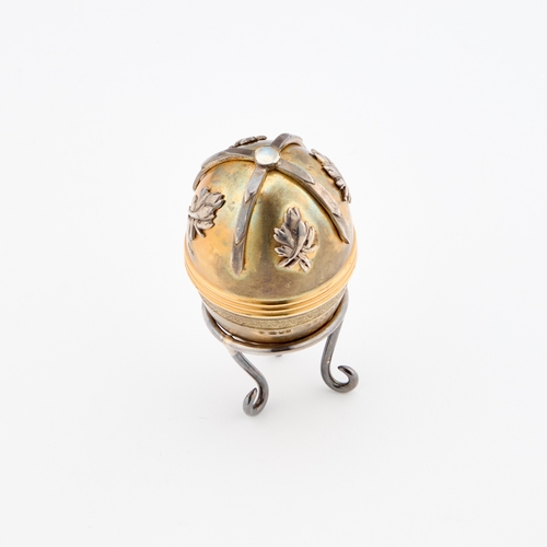 425 - A FABERGÃ STYLE PARCEL-GILT SILVER EGG by St James House Company, London 1982, the egg-shaped box o... 