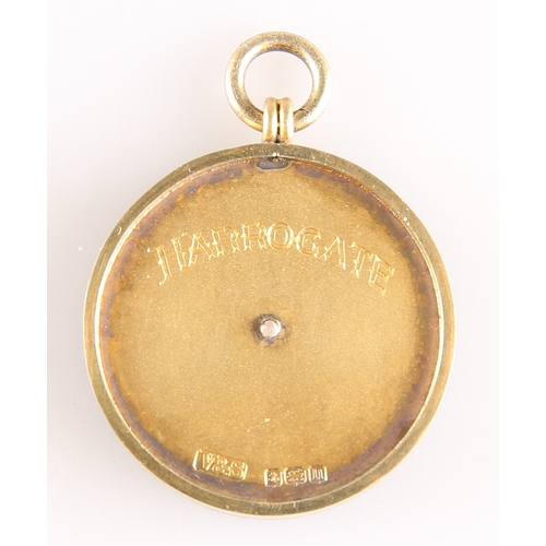 445 - A GEORGE V SILVER-GILT AND ENAMEL 'HARROGATE' FOB MEDALLION by Vaughton & Sons, Birmingham 1912,... 