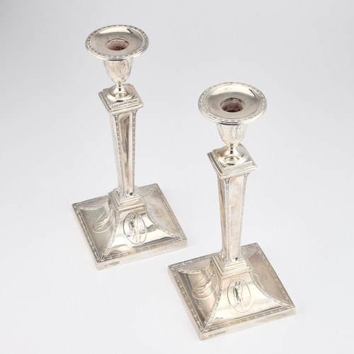 460 - A PAIR OF NEOCLASSICAL REVIVAL SILVER CANDLESTICKS by Hawksworth, Eyre & Co Ltd, Sheffield 1904,... 