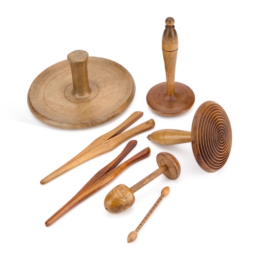 49 - A GROUP OF TREEN comprising darning tools and glove stretchers. (7) Largest 23cm diameter