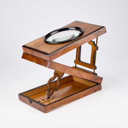 54 - A 19TH CENTURY WALNUT AND EBONISED GRAPHOSCOPE rectangular, label to the underside. 27cm by 18cm... 