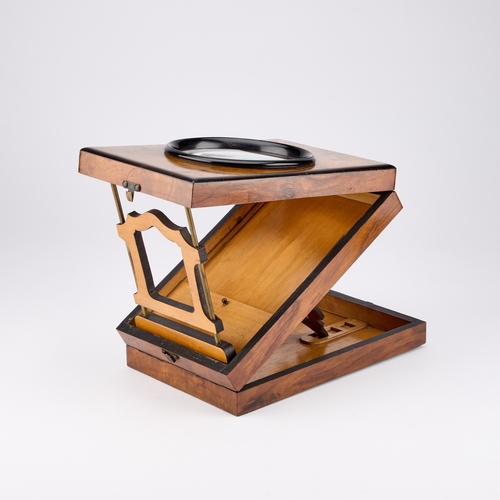 54 - A 19TH CENTURY WALNUT AND EBONISED GRAPHOSCOPE rectangular, label to the underside. 27cm by 18cm... 