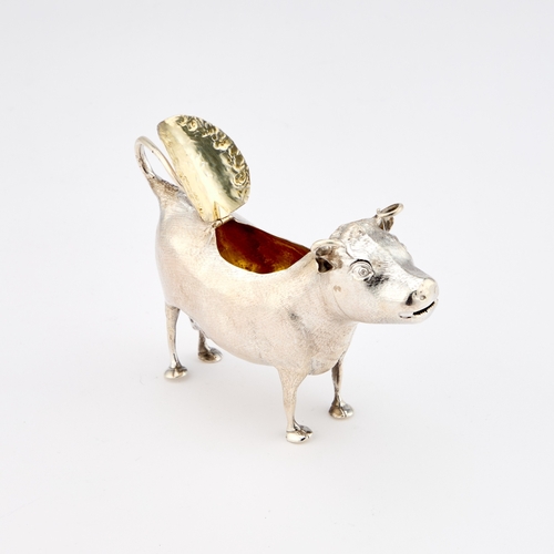 545 - A VICTORIAN SILVER COW CREAMER by William Comyns & Sons, London 1881, typically modelled standin... 