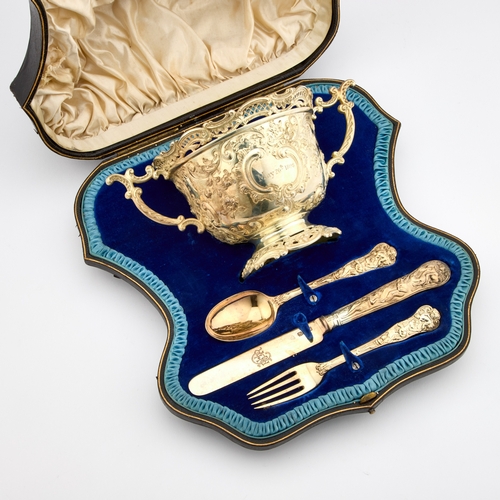 560 - A FINE VICTORIAN SILVER-GILT CASED SET COMPRISING TWO-HANDLED BOWL, FORK, SPOON AND KNIFE the bowl, ... 