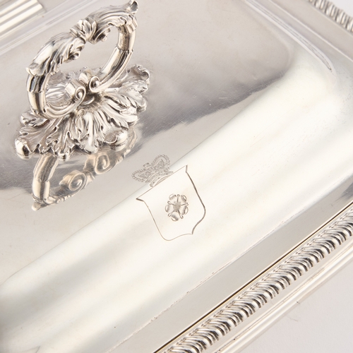 585 - A GEORGE III SILVER CHEESE WARMING DISH by Thomas Robins, London 1812, of rounded rectangular form, ... 