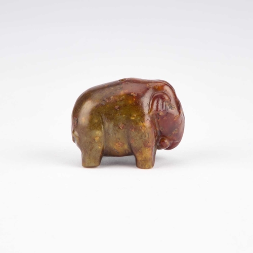 1010 - A CHINESE JADE TOGGLE carved as an elephant standing four-square. 4cm high