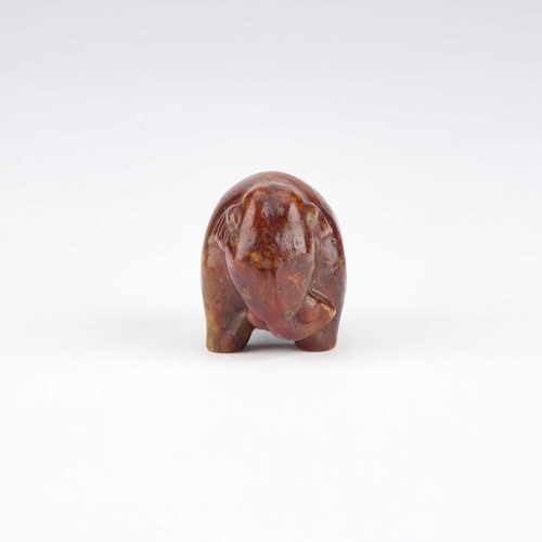 1010 - A CHINESE JADE TOGGLE carved as an elephant standing four-square. 4cm high