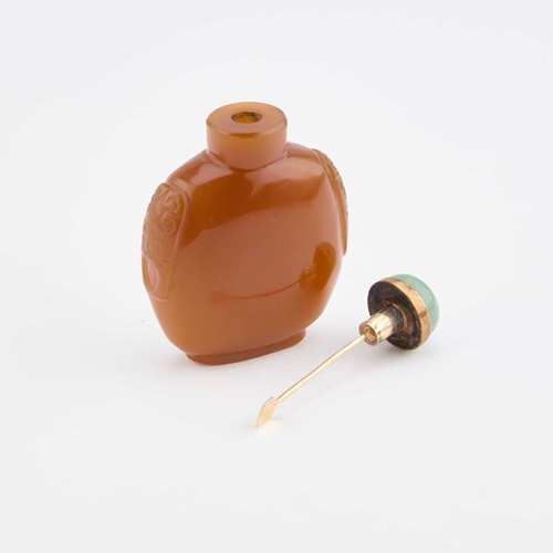 1011 - AN CHINESE AGATE SNUFF BOTTLE the body with carved panels to either shoulder, the jade stopper with ... 