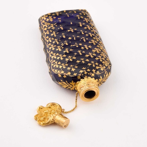 1020 - A LATE 18TH CENTURY GOLD-MOUNTED, BRISTOL BLUE GLASS AND GILT DECORATED SCENT BOTTLE DECORATED IN TH... 