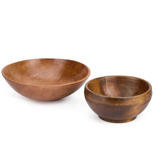 104 - A SYCAMORE DAIRY BOWL, CIRCA 1900 together with a smaller treen bowl. (2) First 30cm diameter